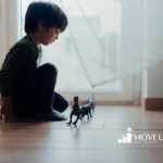 A child playing alone by the window