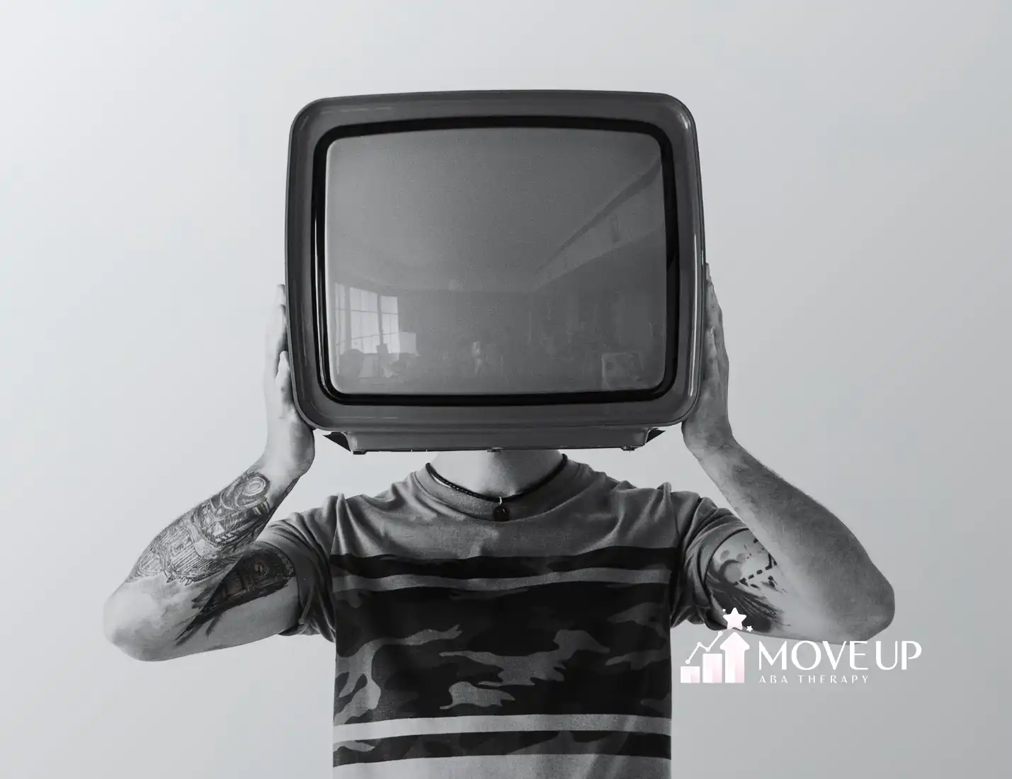 A man with a TV on his head