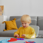 A child with autism is playing with colorful fidget toys on a table