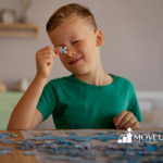 An autistic child is playing with puzzles on a table