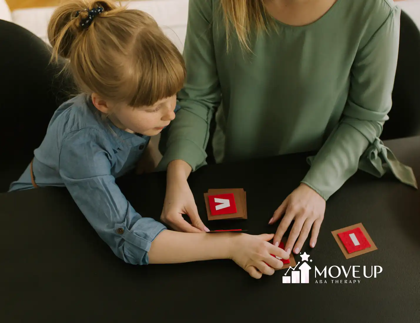 A child and an RBT during ABA therapy