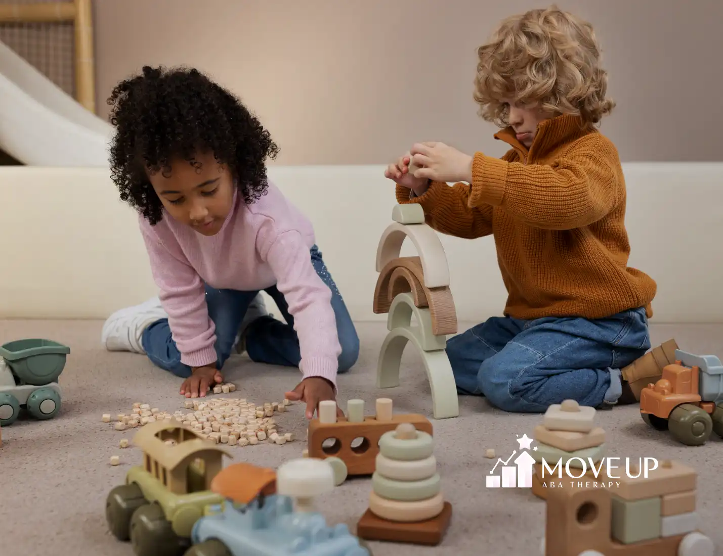 Two kids with autism playing with learning blocks together