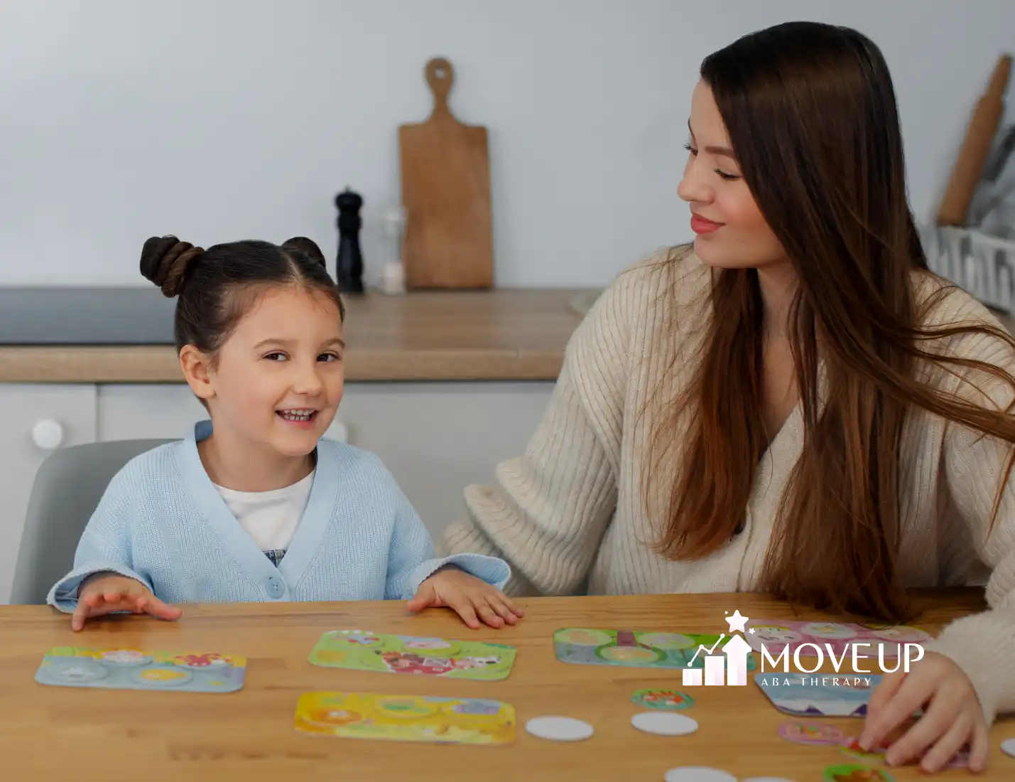 A girl with autism and an RBT during ABA therapy