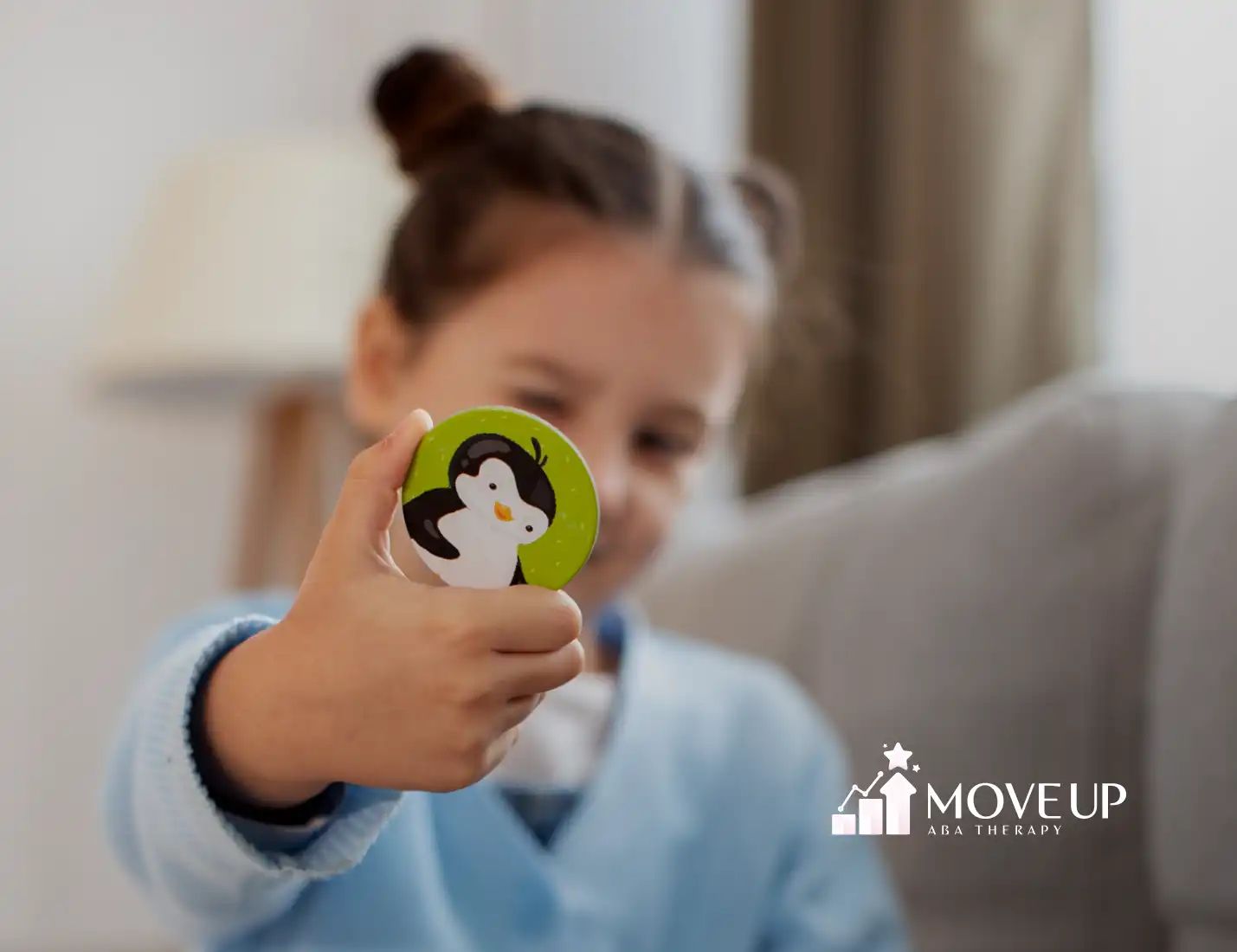 A kid with autism is playing with a toy