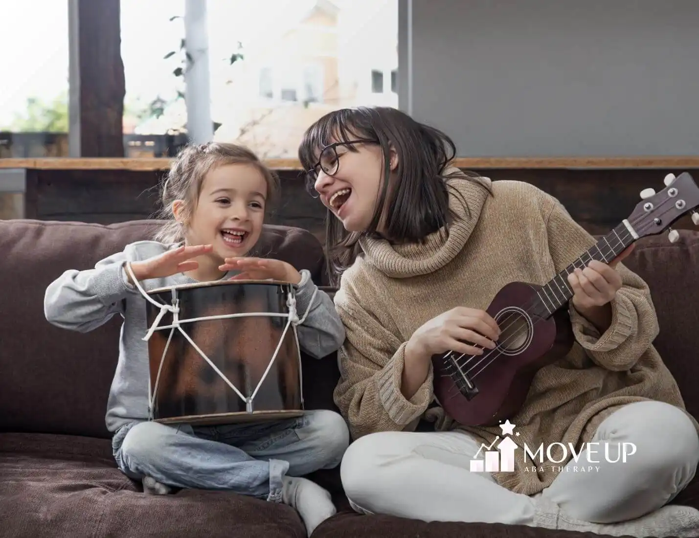 Therapist plays with autistic girl home lessons musical instrument for children development & family values