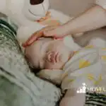 a toddler sleeping on a couch